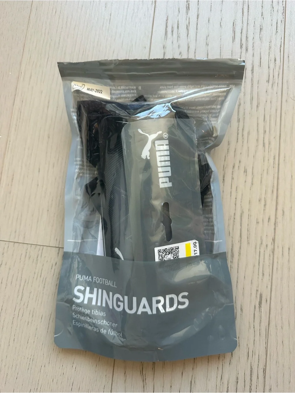 Puma Black Shin Guards with White Logos and Black Sleeves